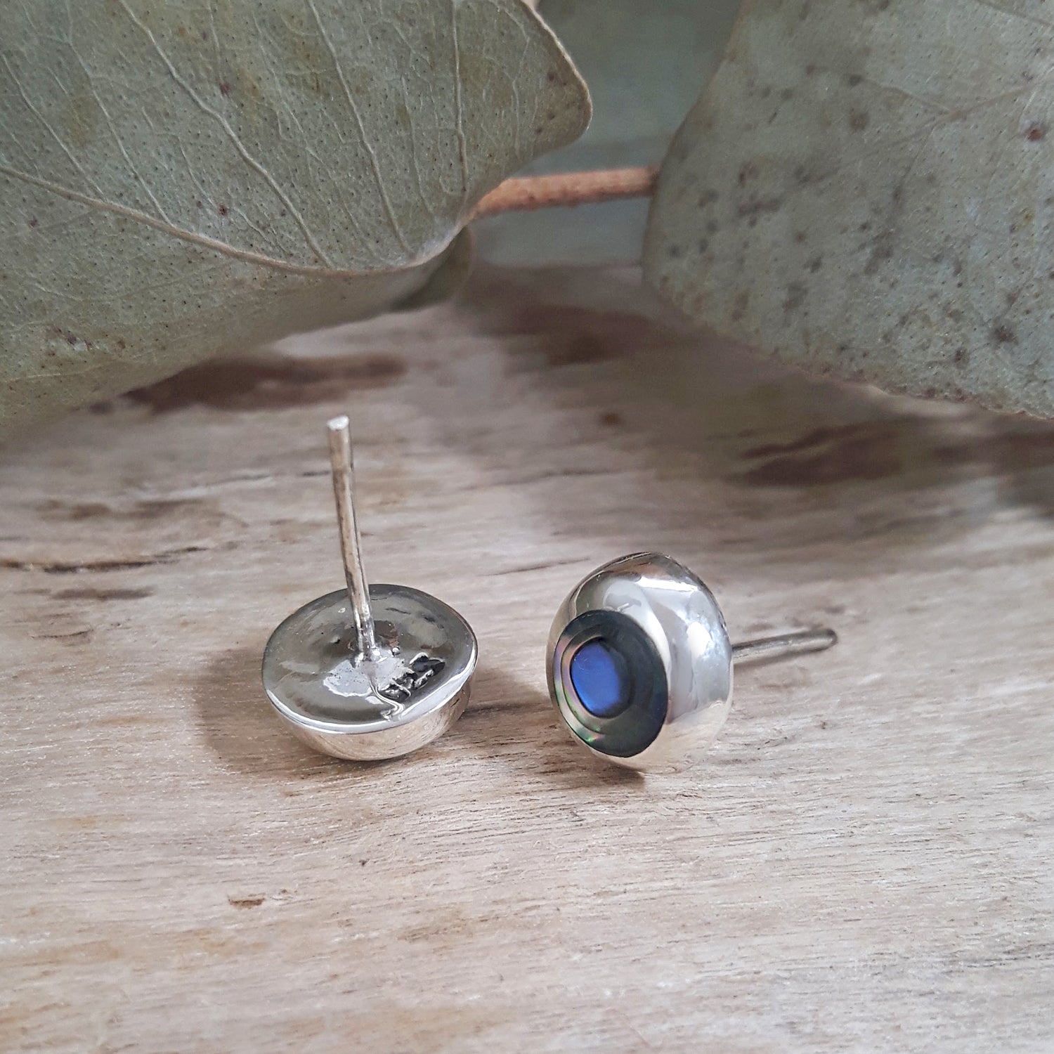 Back and side view of 925 sterling silver abalone circle stud earrings showing stud post and domed silver setting