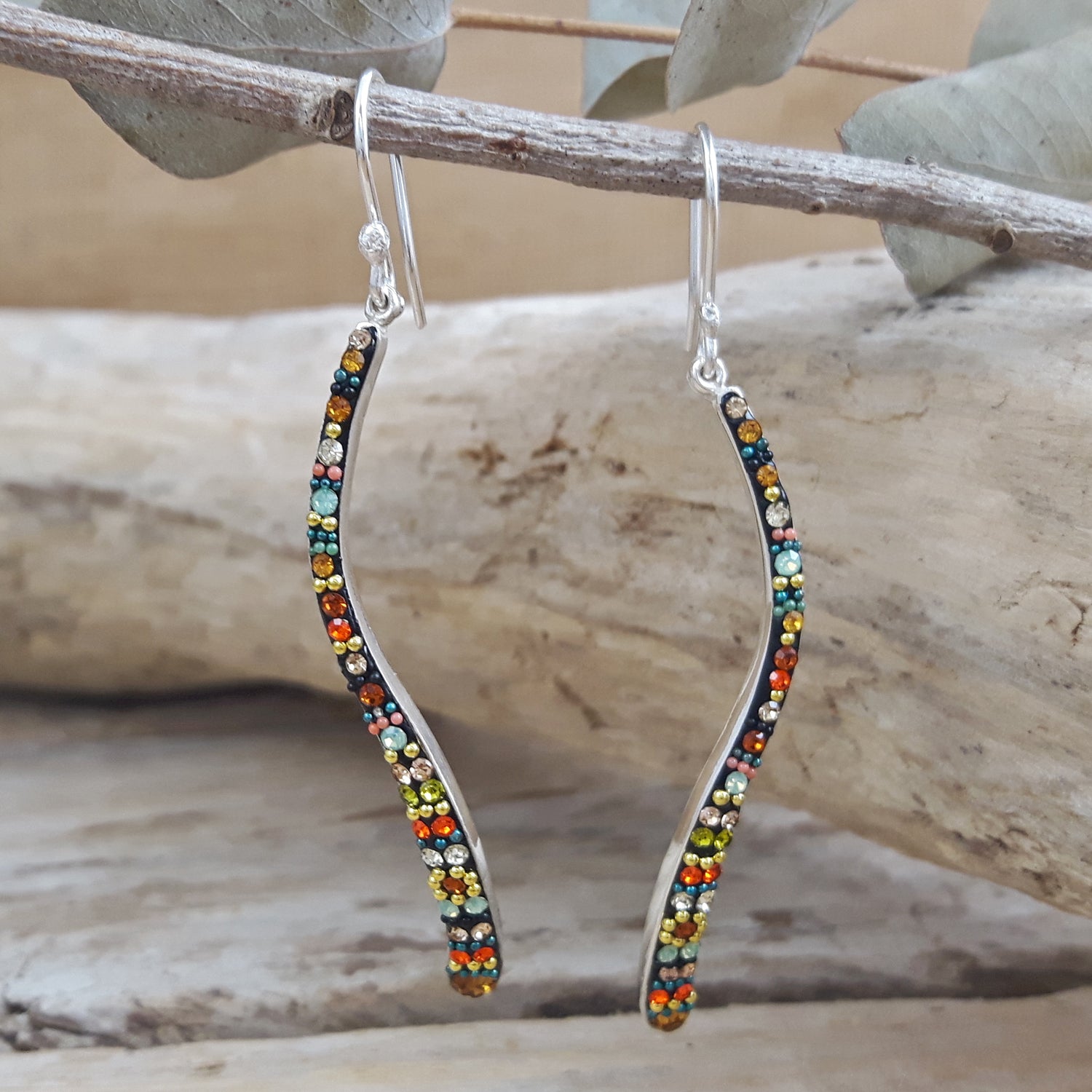 Sterling silver California Dream Sway earrings with colourful micro-pearls and crystals hanging on a branch
