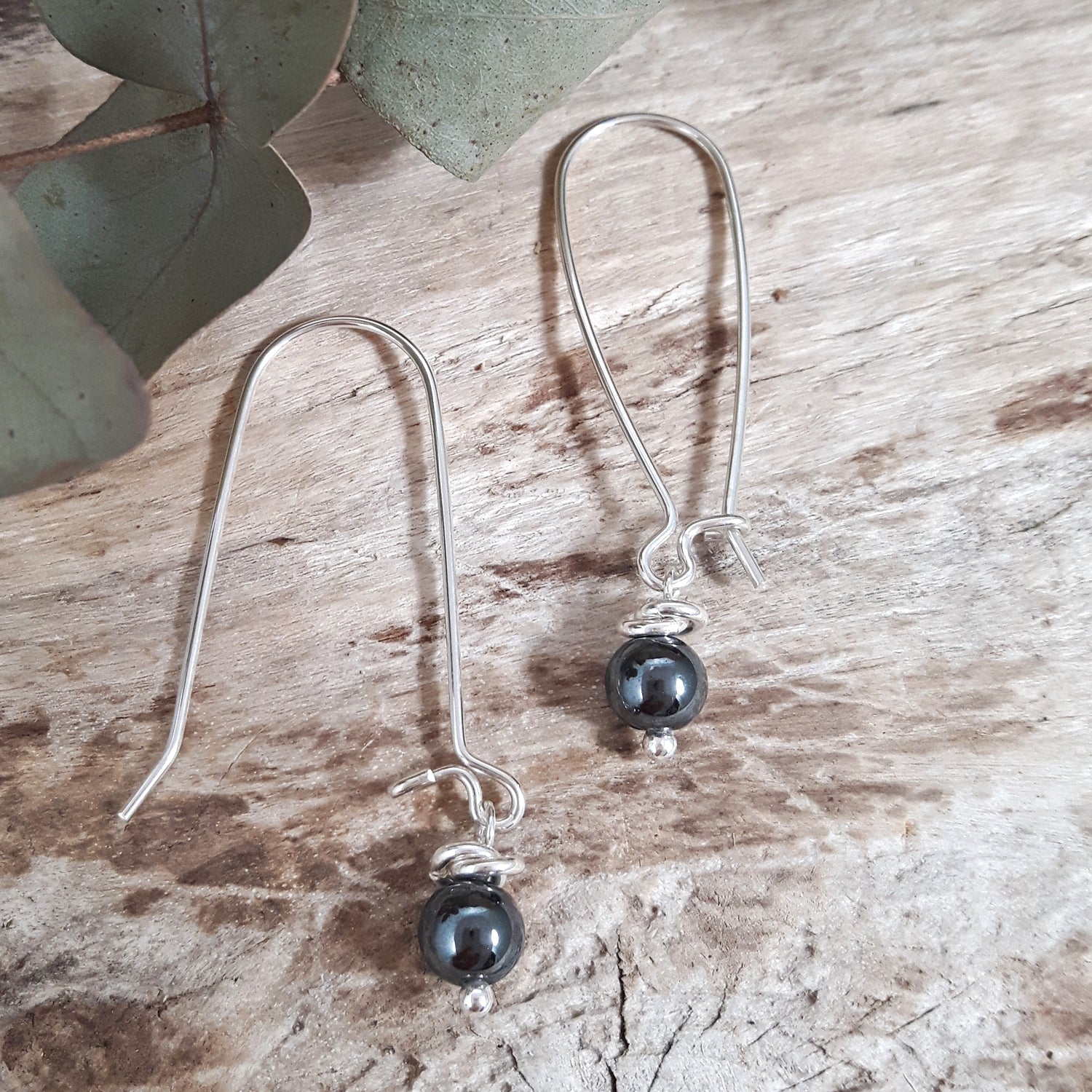 Sterling silver earrings with hematite beads showing hook detail