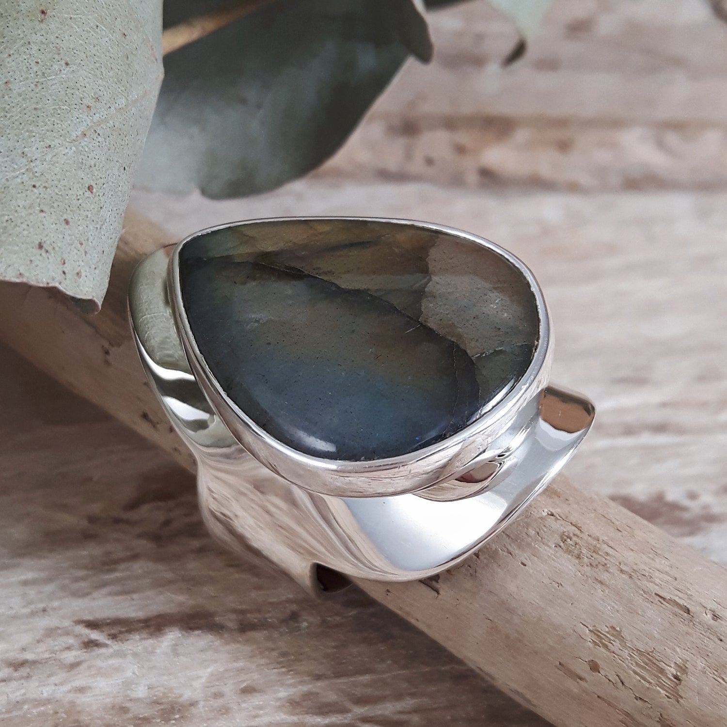 Side view of a unique Labradorite gemstone sterling silver ring.