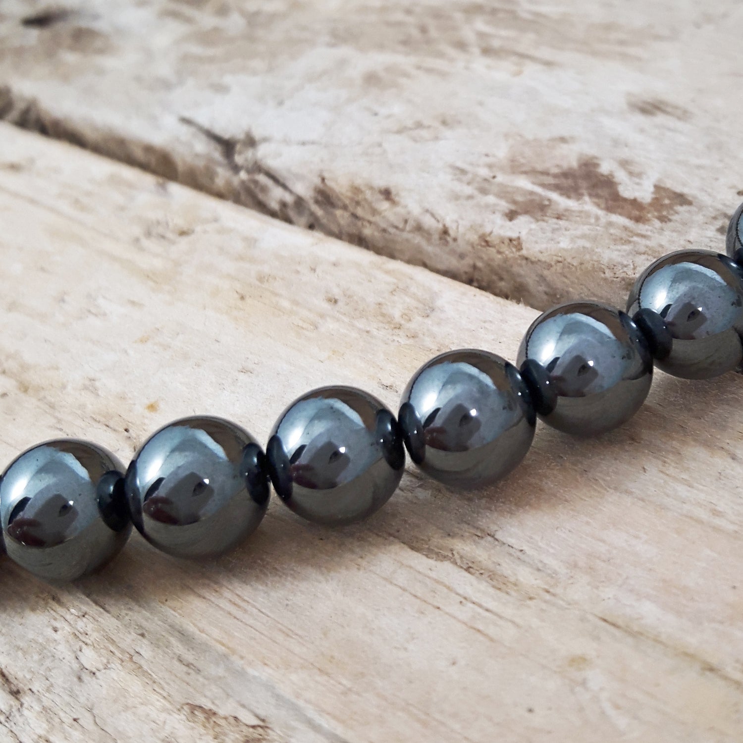 Close up of hematite beads on a gemstone necklace