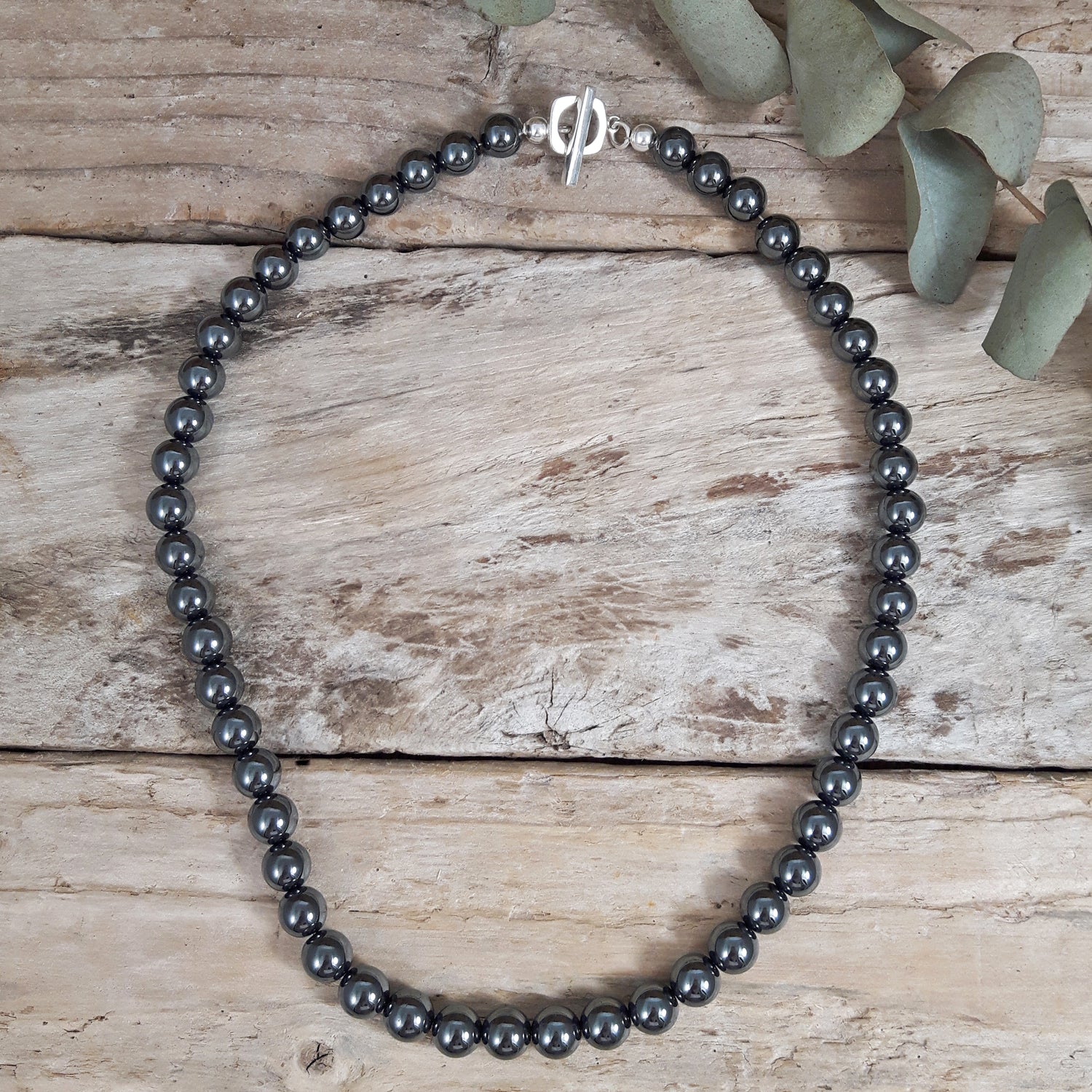 Handcrafted hematite beaded necklace with sterling silver t-bar, designed in the UK