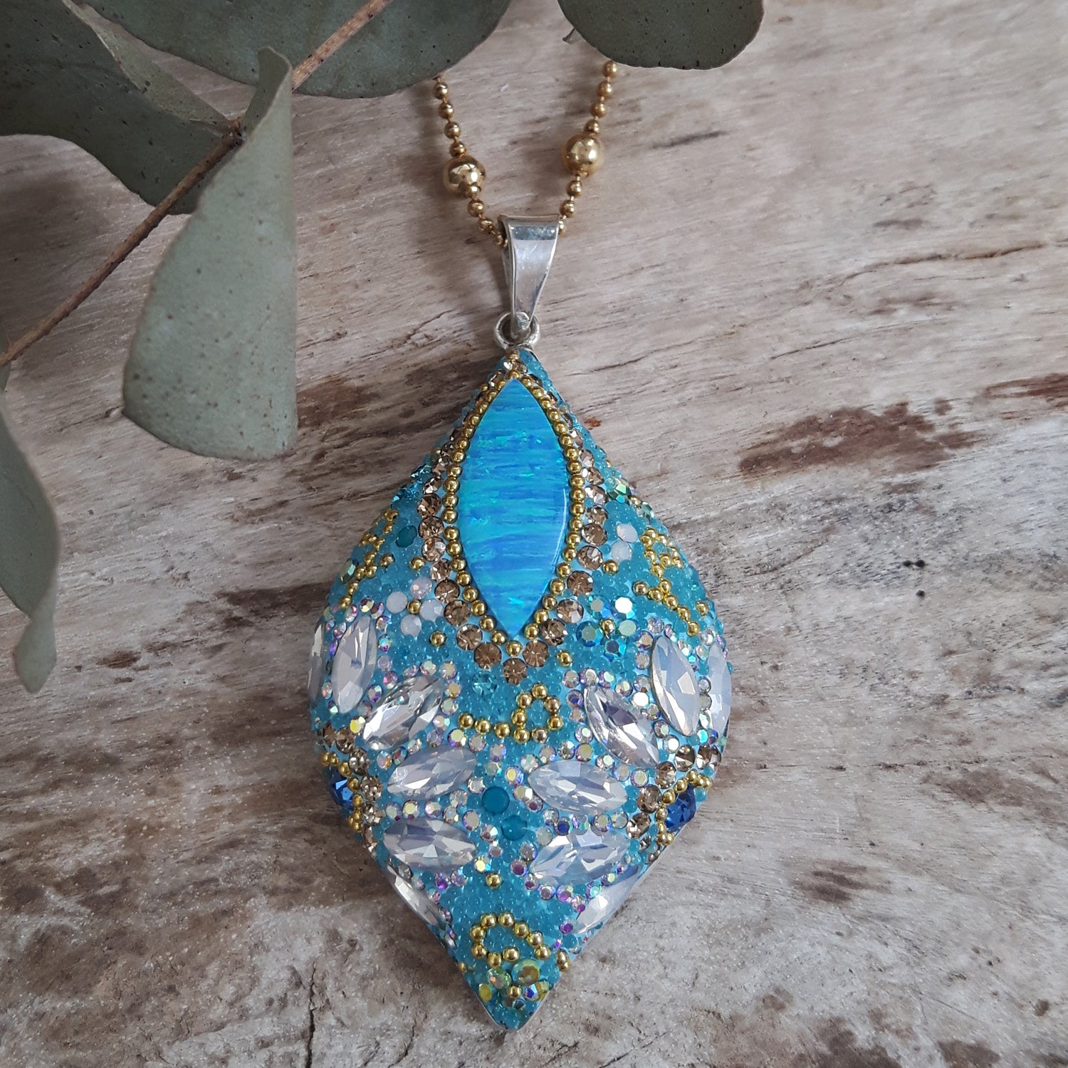 close up opal pendant crystal and micro bead detail from above