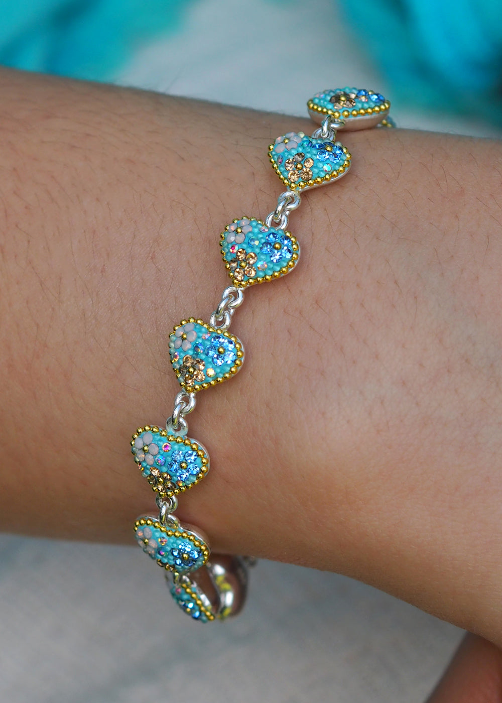 sterling silver heart bracelet worn on wrist