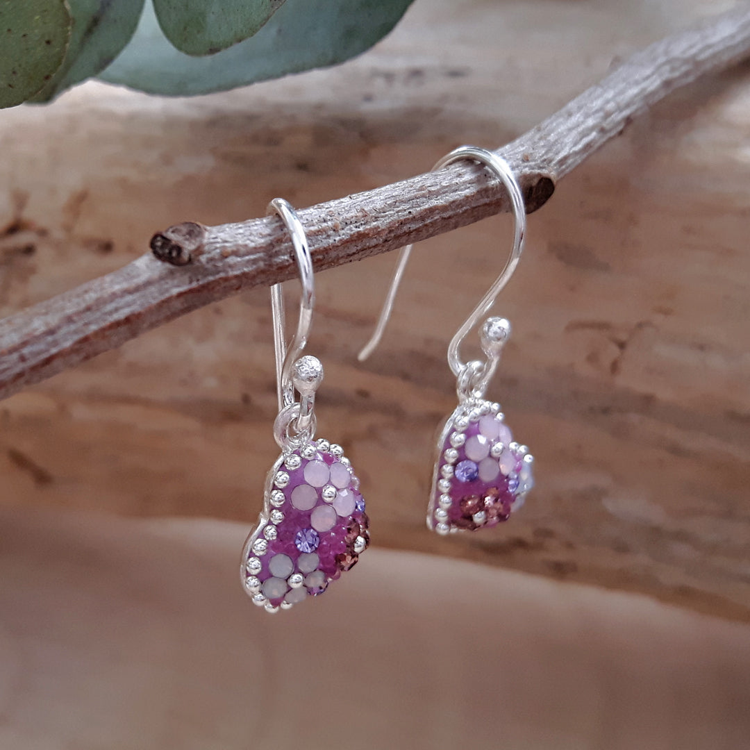close up lilac heart drop earrings detail