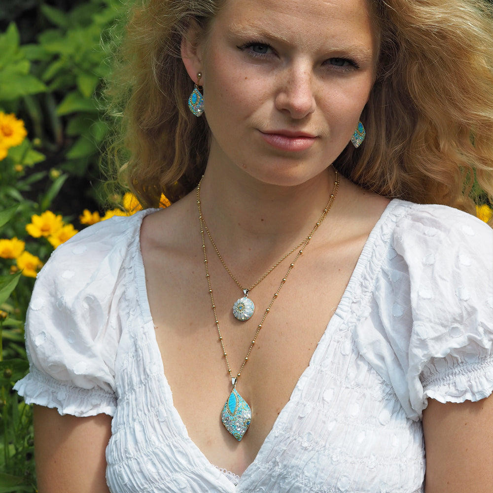 turquoise daisy pendant worn necklace statement