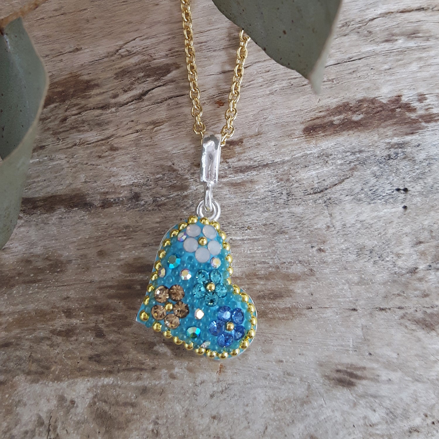 turquoise heart pendant sterling silver on a gold chain necklace