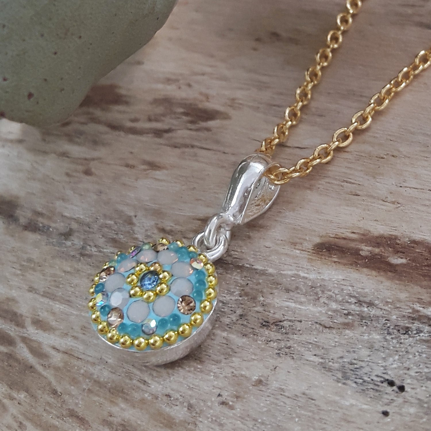 close up daisy pendant crystal and micro bead detail