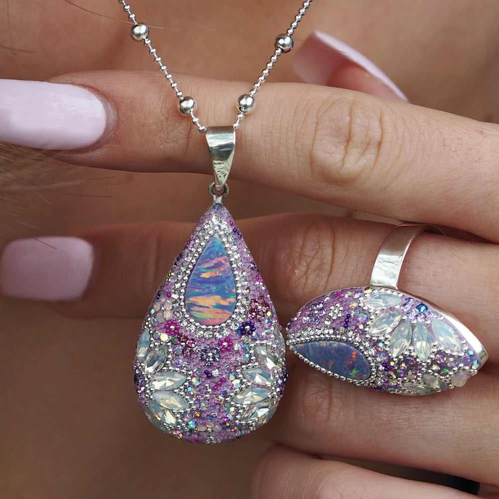 close up lilac pendant opal centre crystal detail worn
