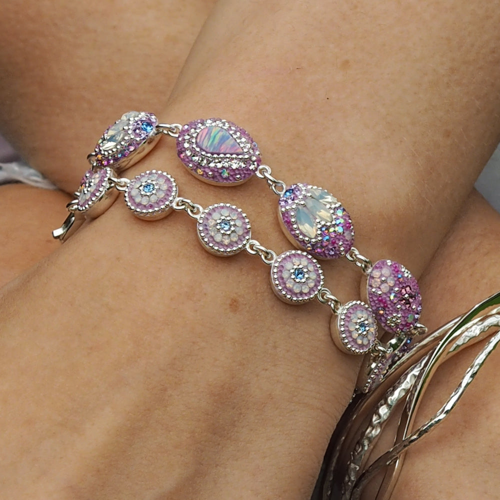 lilac bracelets worn together on wrist statement