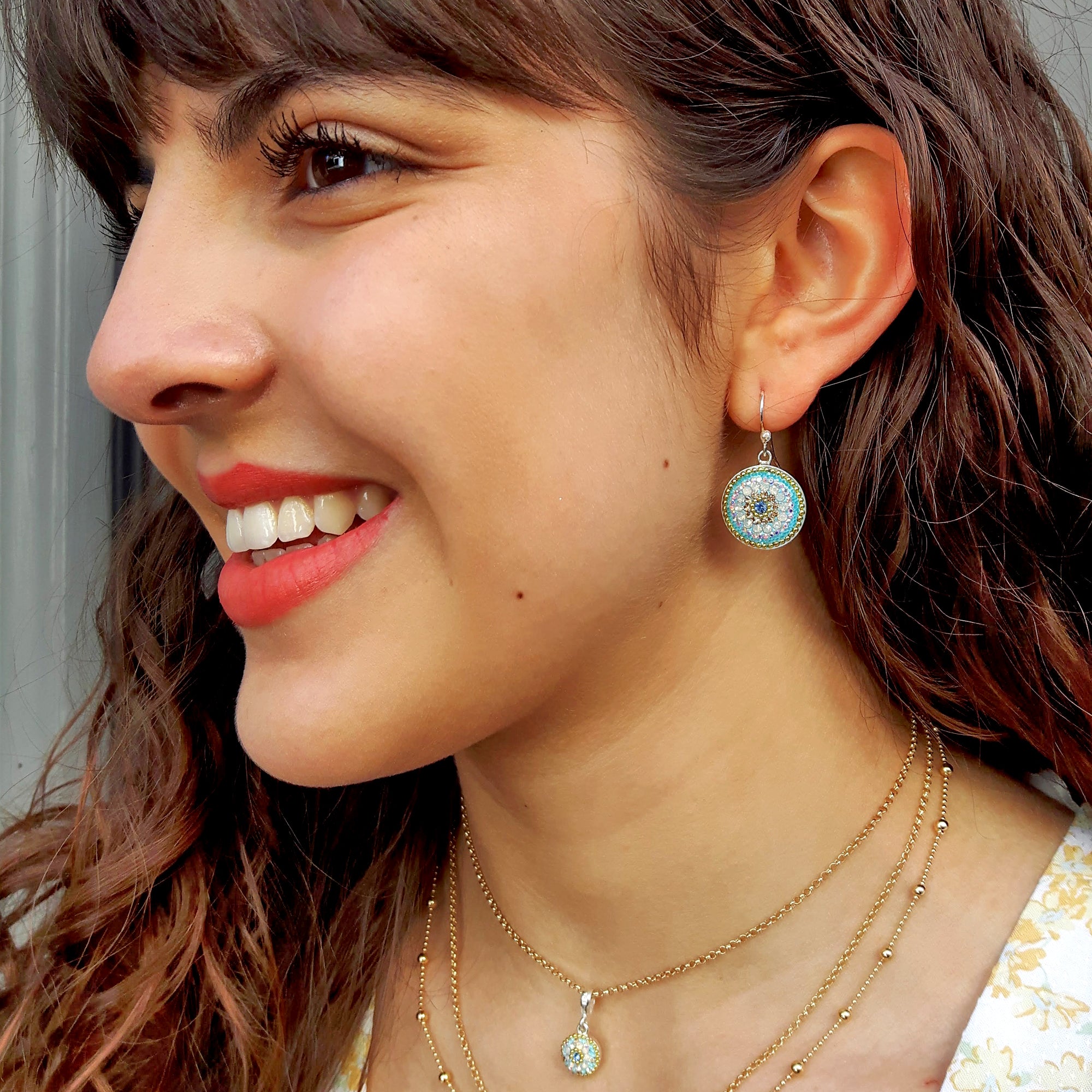 turquoise coin earrings worn on ear statement