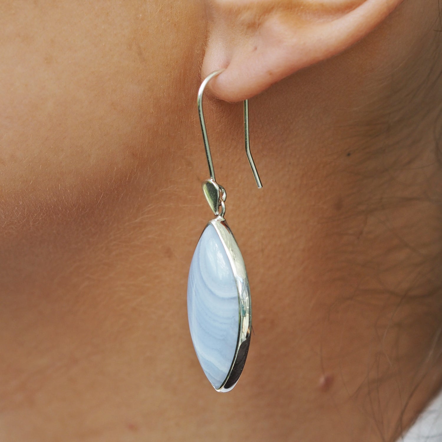 Contemporary blue lace agate drop earrings side view worn in ear