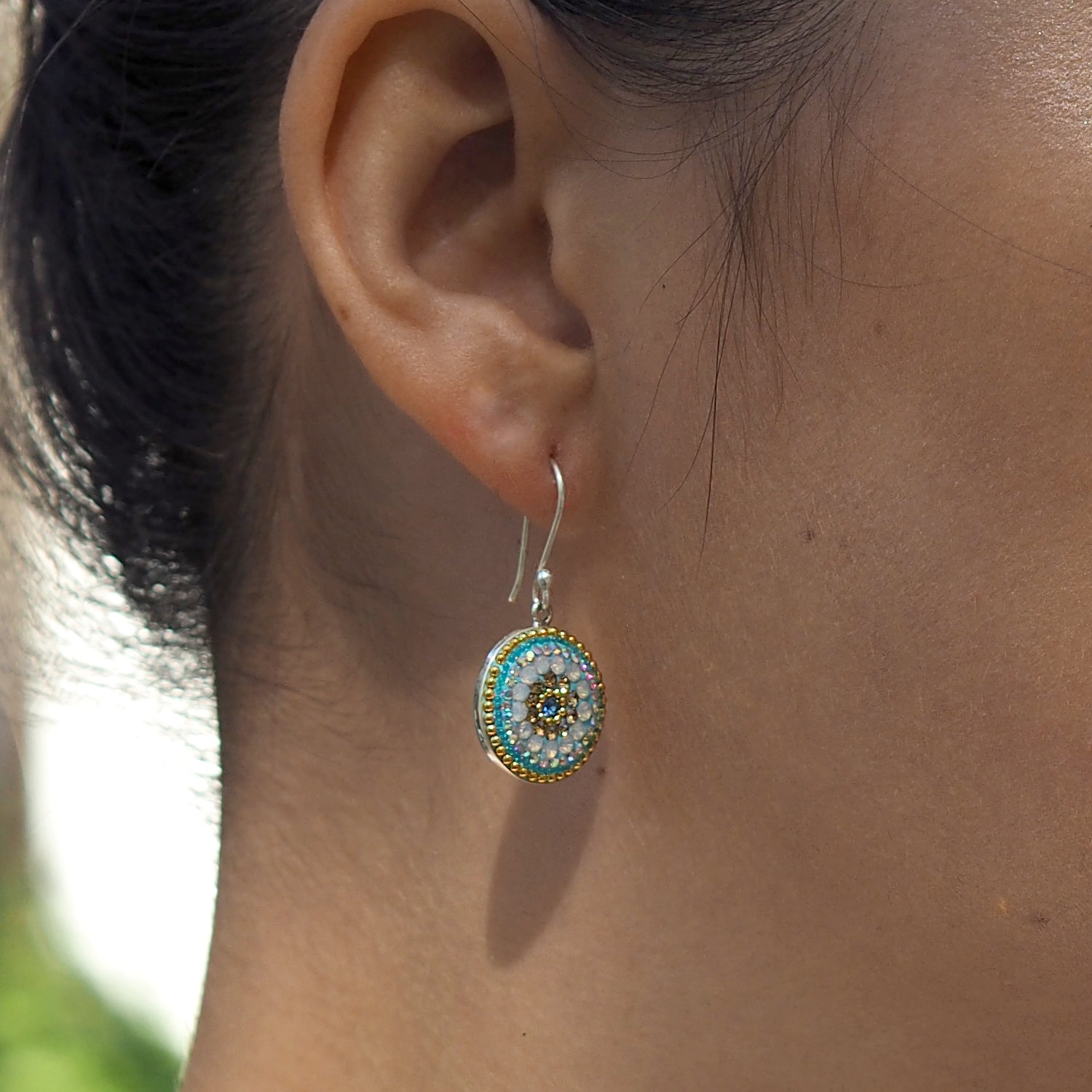 close up daisy coin earrings crystal detail worn