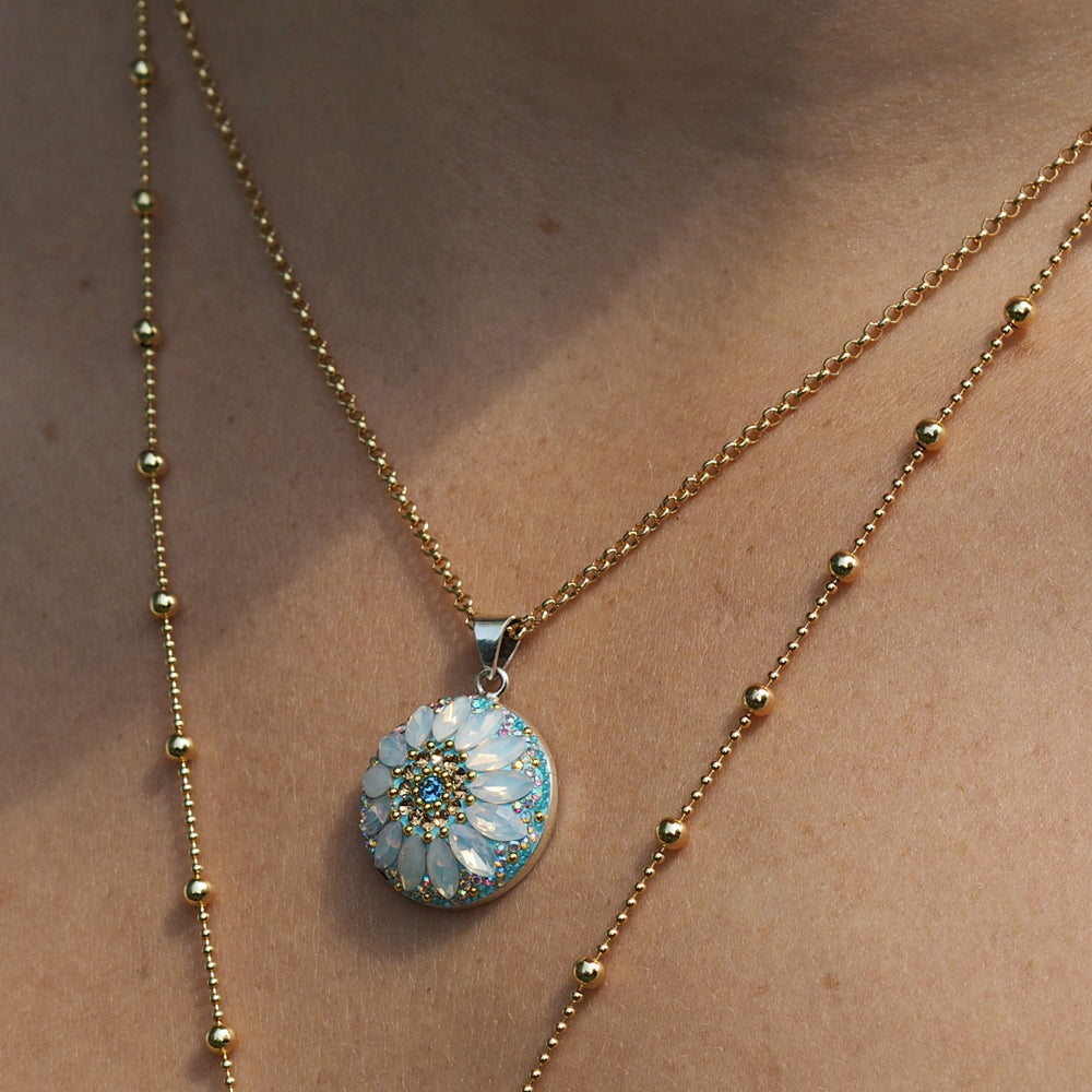 turquoise daisy disc pendant sterling silver handmade worn on model