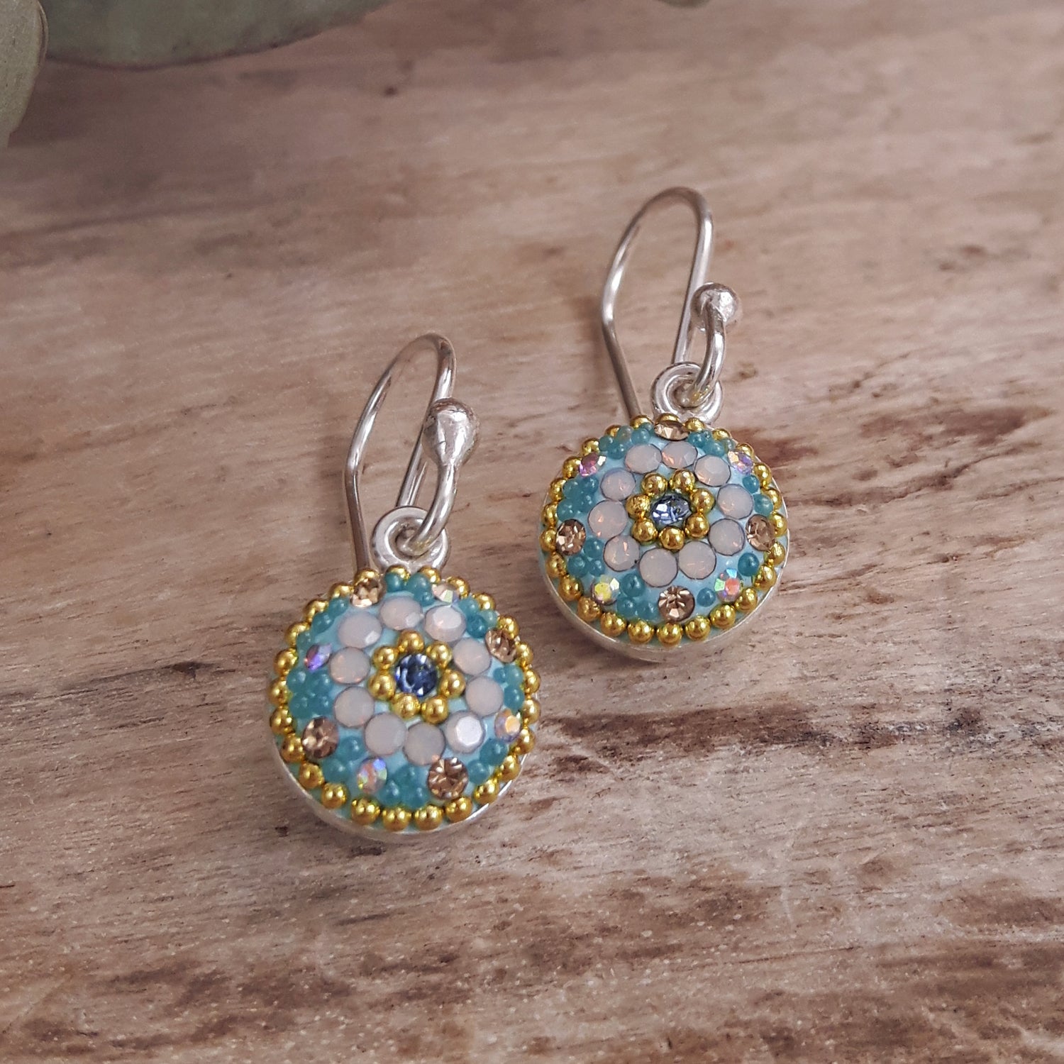 sterling silver turquoise daisy drop earrings worn on ear lightweight