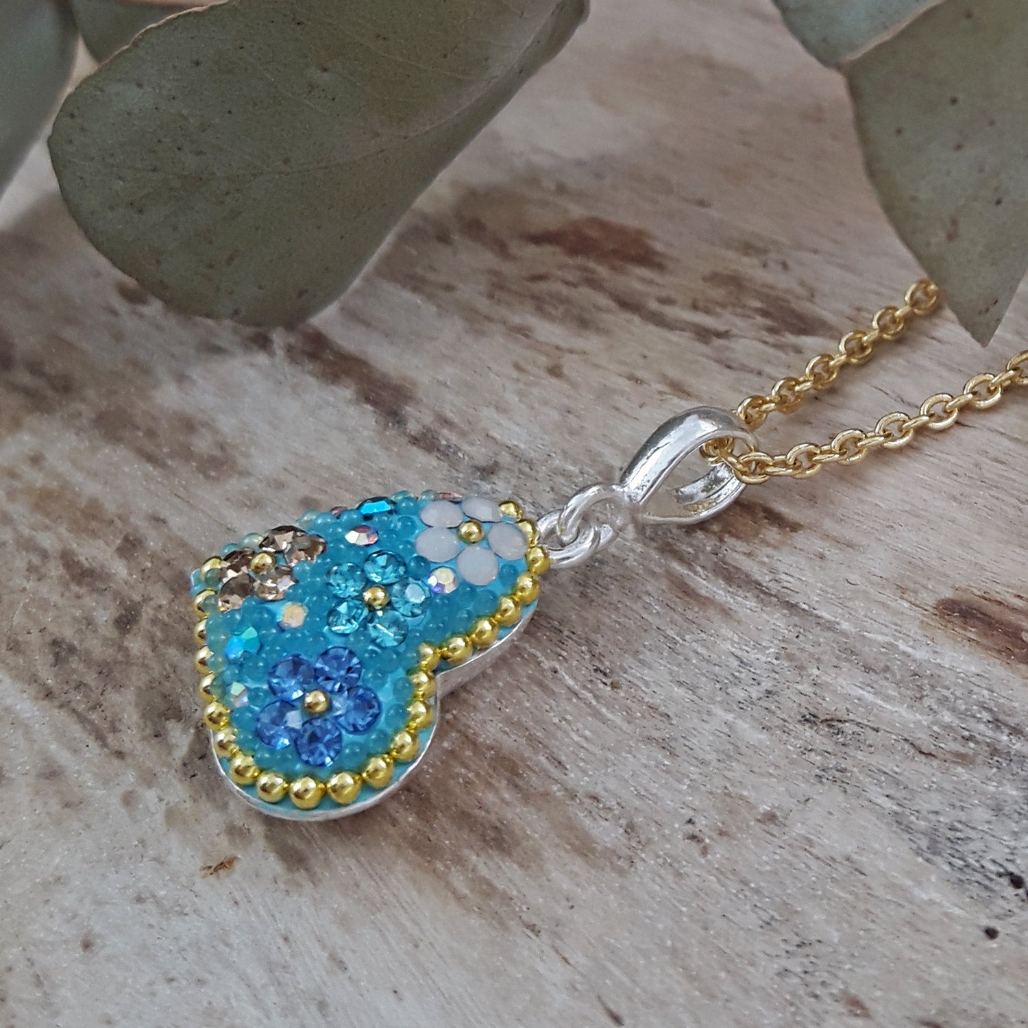 close up heart pendant crystal and micro bead detail