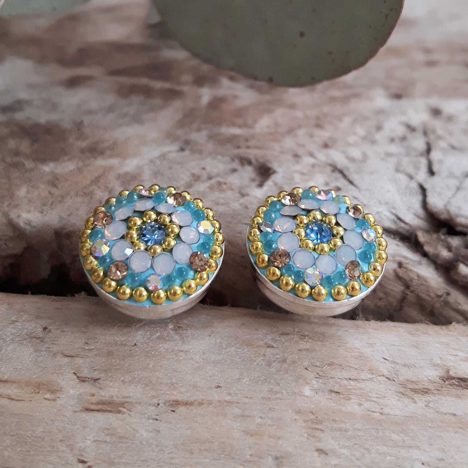 turquoise daisy stud earrings sterling silver handmade floral jewellery styled on natural background
