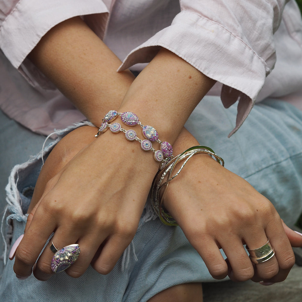 lilac ring worn on hand statement with matching bracelets