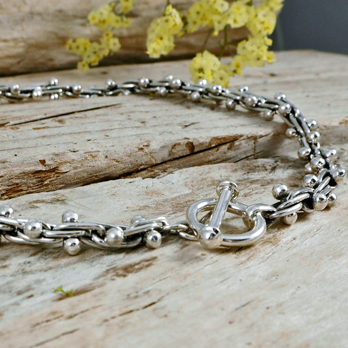 Sterling silver bola discount necklace