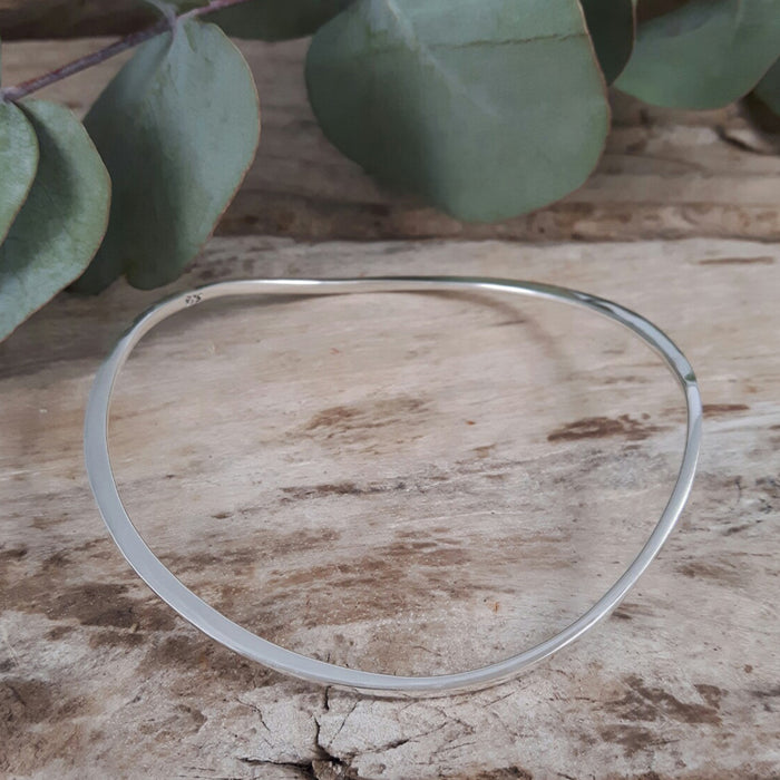 Solid silver sales round bangle