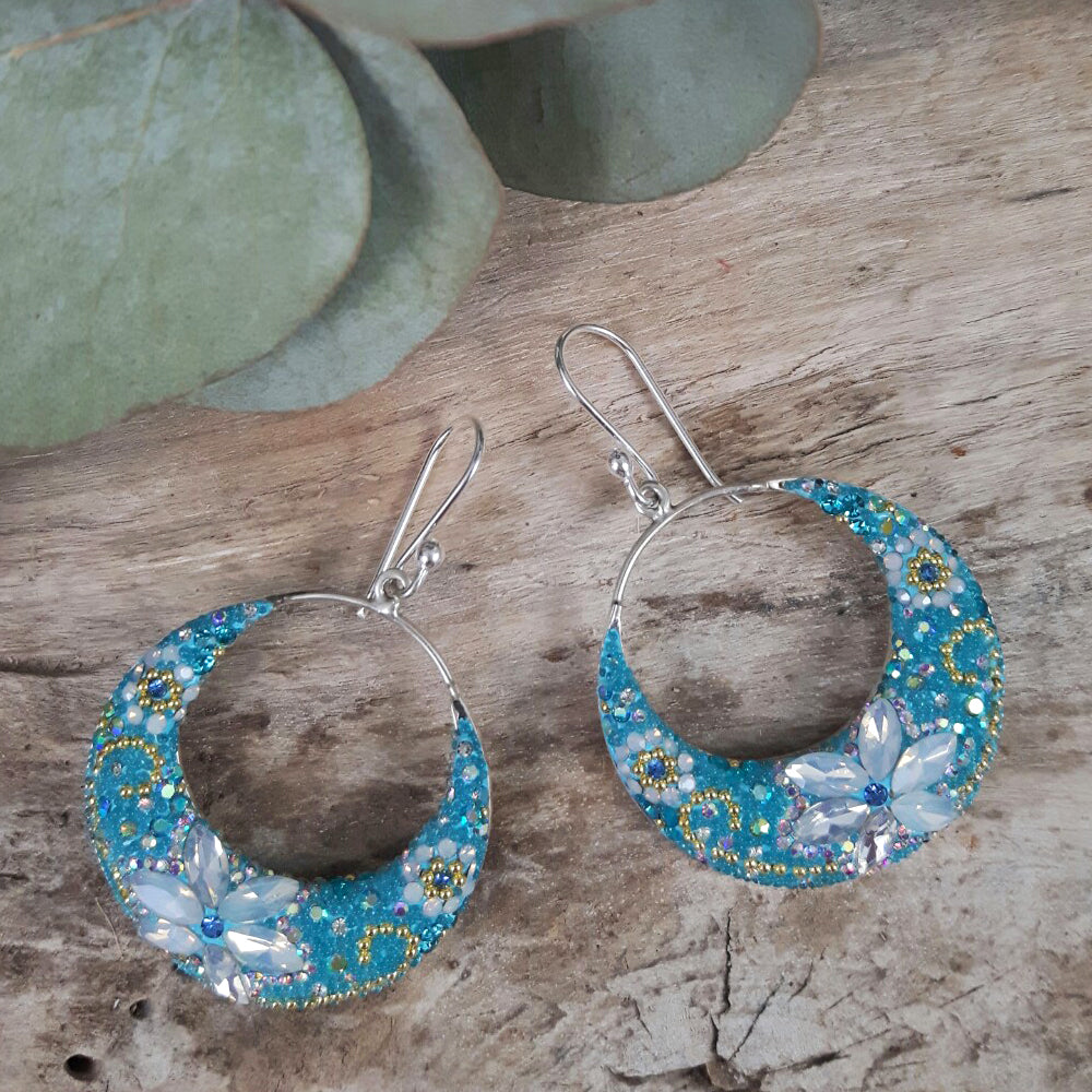 close up floral hoop earrings crystal detail