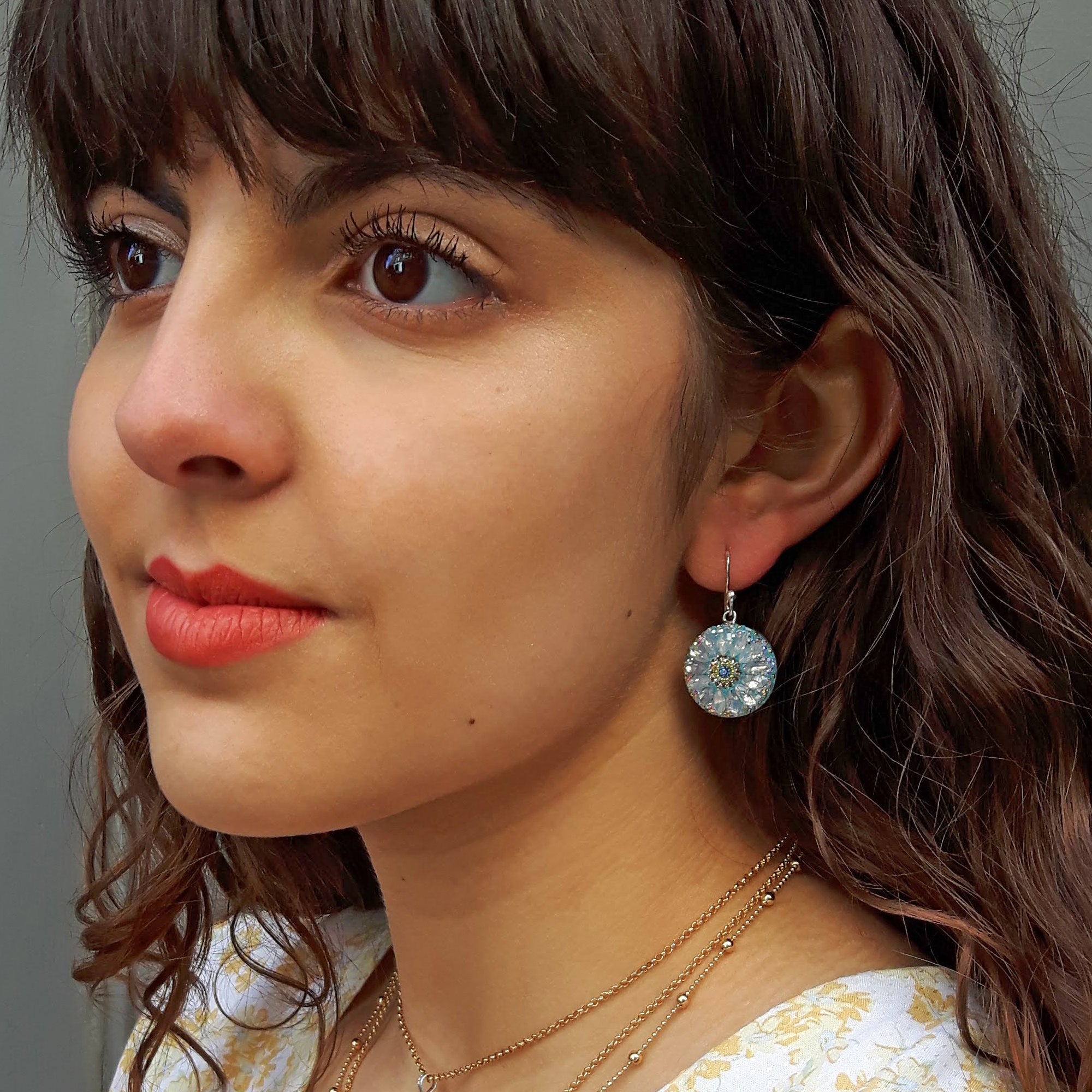 turquoise daisy disc earrings worn on ear statement